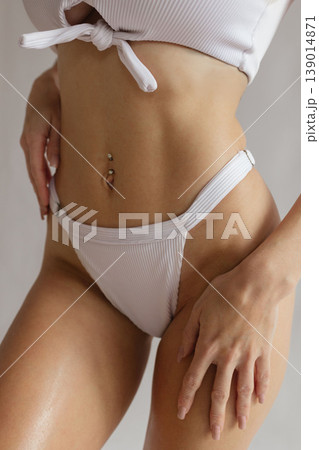 Sexy female body with smooth bikini area and flat stomach in white lingerie, bikini hair removal and body care concept 139014871