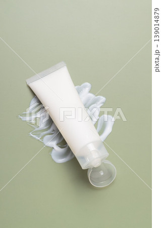 Minimal skincare cosmetic tube with moisturizing cream texture on soft green background, beauty product concept 139014879