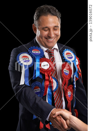 Man, vote and handshake with ribbon, happy and politician for support, government and politics. Elections, voter choice and representative for party, registration and democracy for voting register Man, vote and handshake with ribbon, happy and politician for support, government and politics. Elections, voter choice and representative for party, registration and democracy for voting register 139016072