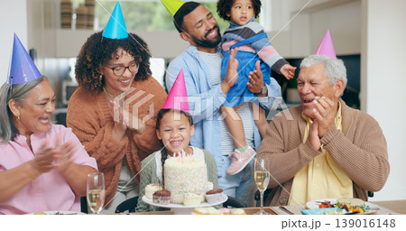 Birthday cake, kids and family with grandparents for celebration, party and singing or clapping with love. Happy interracial mother, father and girl for congratulations or holiday dessert at home 139016148