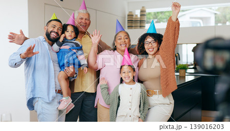 Happy family, birthday hats and photography for party, children and parents. House, grandparents and celebration with timer, excited and cheers with hands, wow and bonding together for memories 139016203