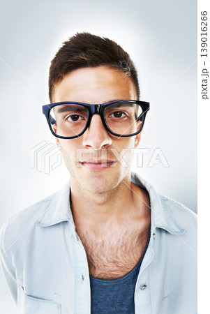 Portrait, serious and business man in glasses in studio isolated on a white background. Face of confident nerd, geek and professional entrepreneur, employee or worker, programmer or coder in Brazil Portrait, serious and business man in glasses in studio isolated on a white background. Face of confident nerd, geek and professional entrepreneur, employee or worker, programmer or coder in Brazil 139016266