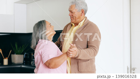 Senior couple, dancing and happy in kitchen, love and house for fun, touch and romantic. Retirement, bonding together and smile for husband, wife and quality time with tango, retired and elderly Senior couple, dancing and happy in kitchen, love and house for fun, touch and romantic. Retirement, bonding together and smile for husband, wife and quality time with tango, retired and elderly 139016328