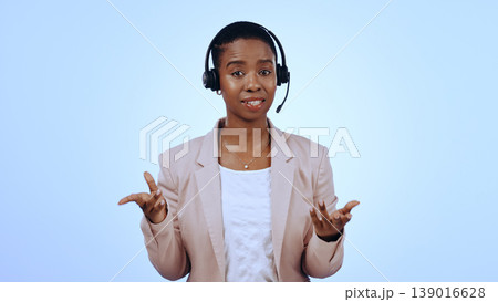 Call center, studio or portrait of black woman in communication, speaking or talking. Blue background, virtual assistant or African financial advisor with microphone in CRM for support or business Call center, studio or portrait of black woman in communication, speaking or talking. Blue background, virtual assistant or African financial advisor with microphone in CRM for support or business 139016628
