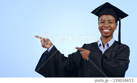 Graduate, portrait or pointing for presentation in studio with smile, announcement or advertising. Black woman, face or excited for marketing, showing deal or discount with hand and joy on mockup Graduate, portrait or pointing for presentation in studio with smile, announcement or advertising. Black woman, face or excited for marketing, showing deal or discount with hand and joy on mockup 139016653