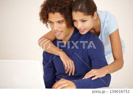 Hug, happy and couple on laptop for online shopping, browse internet and social networking together. Dating, love and man and woman embrace on computer for reading website, streaming service and blog 139016752