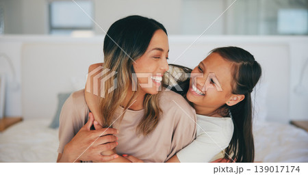 Face, laughing and a mother hugging her daughter in the bedroom of their home in the morning together. Family, love and funny young girl embracing her single parent while on a bed in their apartment Face, laughing and a mother hugging her daughter in the bedroom of their home in the morning together. Family, love and funny young girl embracing her single parent while on a bed in their apartment 139017174