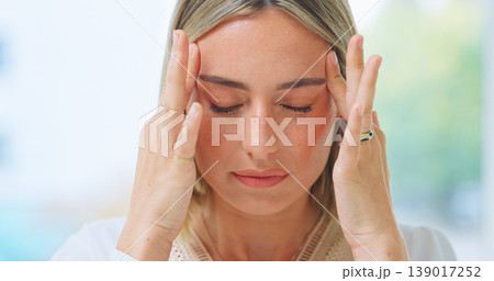 Mental health, woman or headache in home with burnout, stress and risk in living room from migraine. Person, wellness and anxiety or discomfort from strain in lounge of house with depression or tired 139017252