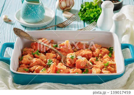 Indian fish curry with cauliflower and green peas 139017459