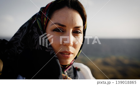 Muslim woman wearing a headscarf in the desert Muslim woman wearing a headscarf in the desert 139018865