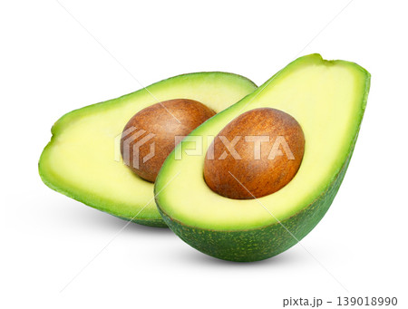 Cut in a halves of avocado isolated. Green avocado half with clipping path. Cut in a halves of avocado isolated. Green avocado half with clipping path. 139018990