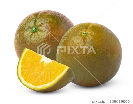 Two whole chocolate navel orange fruits and cut in a slice isolated. Bronze orange citrus fruit. Two whole chocolate navel orange fruits and cut in a slice isolated. Bronze orange citrus fruit. 139019000