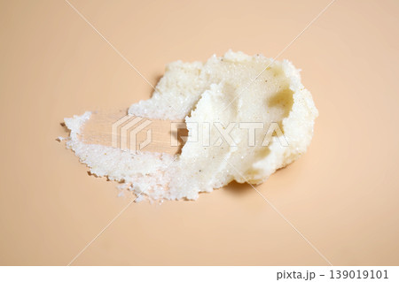 Skincare exfoliant texture cosmetic innovation swirled on peach background Skincare exfoliant texture cosmetic innovation swirled on peach background 139019101