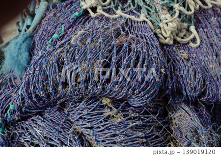 Studies of fishing nets on the south east coast of Cornwall, harbour-side in the sunshine 139019120