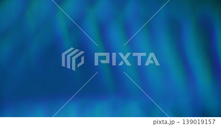 Defocused luminosity. Leak lens. Neon color reflection bright texture. Blue green fluorescent glowing stripes abstract blur background. Defocused luminosity. Leak lens. Neon color reflection bright texture. Blue green fluorescent glowing stripes abstract blur background. 139019157
