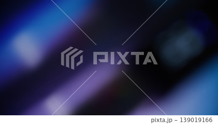 Film defocused glow. Neon luminosity. Colorful mixing purple blue reflection. Striped optical lens on art black abstract background. Film defocused glow. Neon luminosity. Colorful mixing purple blue reflection. Striped optical lens on art black abstract background. 139019166