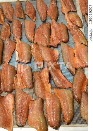 The surface or background of sun-dried striped snakehead fish has a salty taste, which is a type of food preservation used in Asia. The surface or background of sun-dried striped snakehead fish has a salty taste, which is a type of food preservation used in Asia. 139019207