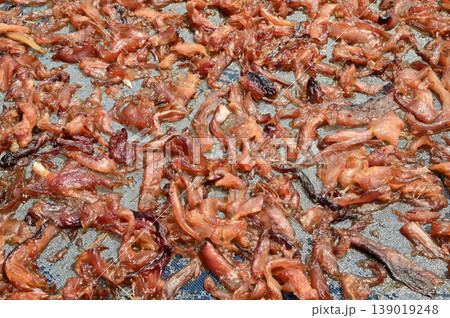 The surface or background of sun-dried striped snakehead fish has a salty taste, which is a type of food preservation used in Asia. 139019248