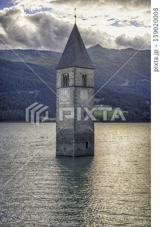 The iconic submerged Church Tower of Graun, Lake Reschensee, Italy The iconic submerged Church Tower of Graun, Lake Reschensee, Italy 139020008