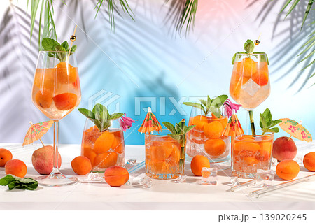 Modern still life with mojito, alcoholic cocktail, peach, apricot and mint berries on elegant modern background, minimalist concept for bar and holiday party, cafe, advertising banner, Modern still life with mojito, alcoholic cocktail, peach, apricot and mint berries on elegant modern background, minimalist concept for bar and holiday party, cafe, advertising banner, 139020245