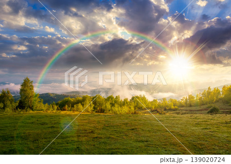 foggy sunset over carpathian mountain landscape. outdoor adventure with stunning view in evening light. countryside landscape with rolling hills, fog and cloudy sky. weather with rainbow foggy sunset over carpathian mountain landscape. outdoor adventure with stunning view in evening light. countryside landscape with rolling hills, fog and cloudy sky. weather with rainbow 139020724