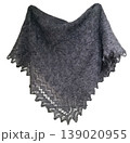A grey downy shawl is displayed in a bright space. The shawl is handmade and features a delicate pattern along the edge. It is made from soft goat down, emphasizing its warmth and texture. 139020955
