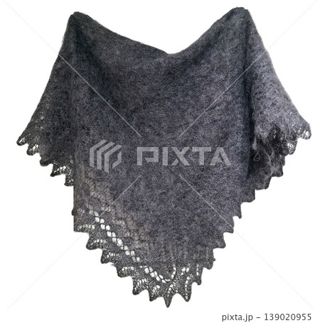 A grey downy shawl is displayed in a bright space. The shawl is handmade and features a delicate pattern along the edge. It is made from soft goat down, emphasizing its warmth and texture. 139020955