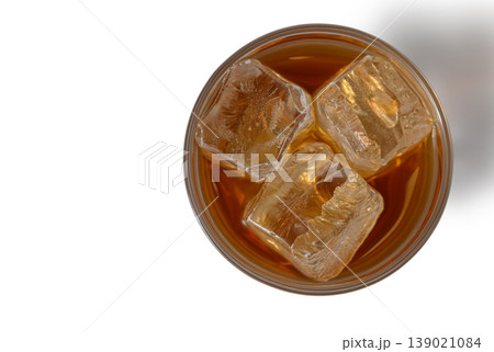 Top View of Whiskey Glass with Ice Isolated on White Background Top View of Whiskey Glass with Ice Isolated on White Background 139021084