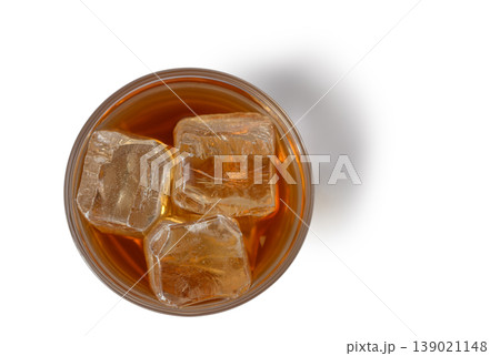 Whiskey with Ice Cubes on White Background Top View Whiskey with Ice Cubes on White Background Top View 139021148