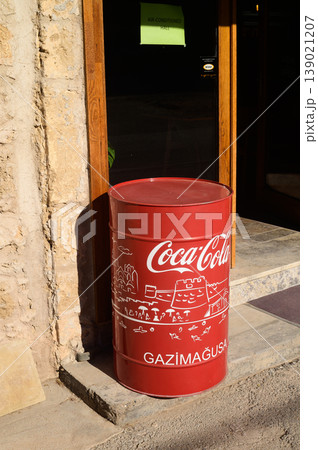 Brightly colored Coca-Cola drum standing outside a quaint shop in Gazimagusa Brightly colored Coca-Cola drum standing outside a quaint shop in Gazimagusa 139021207