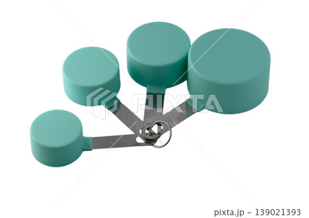 Complete set of eco green kitchen measuring cups in different sizes, flat lay on white Complete set of eco green kitchen measuring cups in different sizes, flat lay on white 139021393