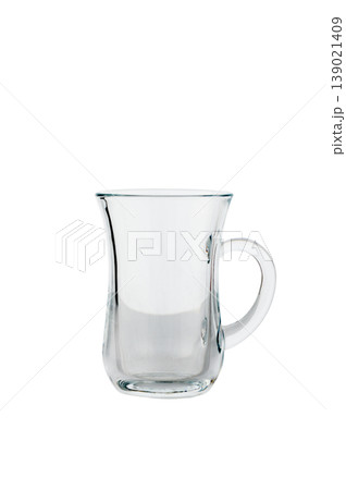 Glass tea mug with handle, isolated on white background. 139021409