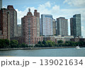 Metropolitan Skyline Highlights Busy Port Activity With Sailboats And Modern Structures. New York 139021634