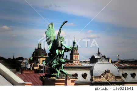 Historical architecture of the old city with churches and patina sculptures Historical architecture of the old city with churches and patina sculptures 139021641