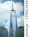 Majestic Manhattan Highrise With Reflective Glass Surface Reaching Into Clear Sky 139021648