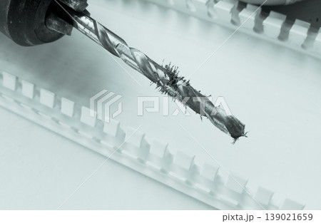 Magnetized shavings on the metal drill bit macro shot  139021659