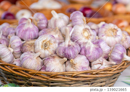 Garlic in a basket for sale at a market stall 139021665