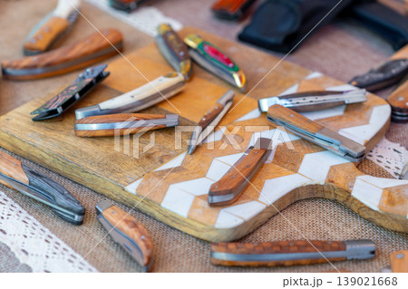 Small handmade pochet knives displayed for sale at the market Small handmade pochet knives displayed for sale at the market 139021668