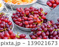 Red grapes on aluminum plates for sale at a market stall 139021673