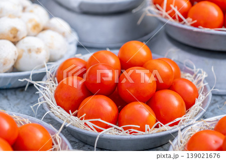 Tomatoes and various vegetables on a market stall Tomatoes and various vegetables on a market stall 139021676
