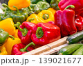 Red and yellow bell peppers for sale at a market stall 139021677