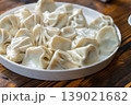 A plate of Georgian khinkali dumplings, Georgian dumplings served on a white plate 139021682
