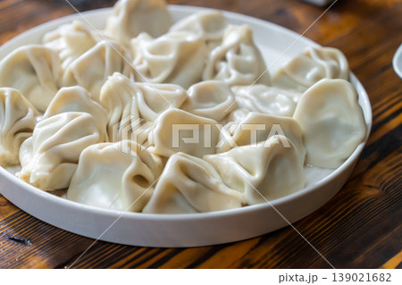 A plate of Georgian khinkali dumplings, Georgian dumplings served on a white plate 139021682