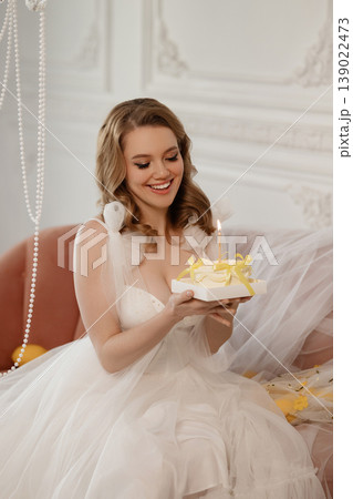 Bridal Cake Celebration. Joyful Bride Beams While Holding Cake With Twinkle Reflections Bridal Cake Celebration. Joyful Bride Beams While Holding Cake With Twinkle Reflections 139022473