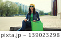 Stylish beautiful young woman posing with shopping bags 139023298