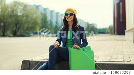 Stylish beautiful young woman posing with shopping bags 139023298