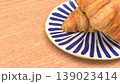 Fresh Croissant Breakfast on Plate with Wooden Table Background 3d render. 139023414
