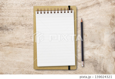 Flat lay top view with blank notepad and black pencil 139024321