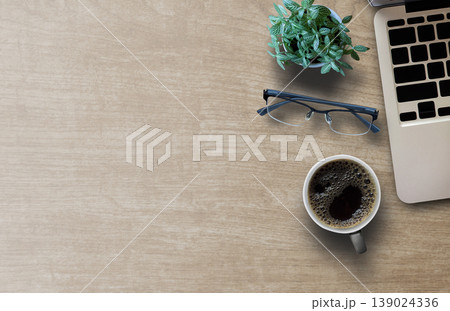 Flat lay top view photo of laptop keyboard with mug of beverage Flat lay top view photo of laptop keyboard with mug of beverage 139024336
