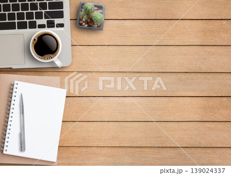 Flat lay top view photo of laptop keyboard with mug of beverage 139024337
